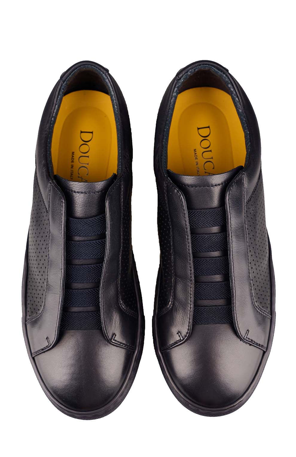 Кожаные кеды с эластичными лентами и перфорацией