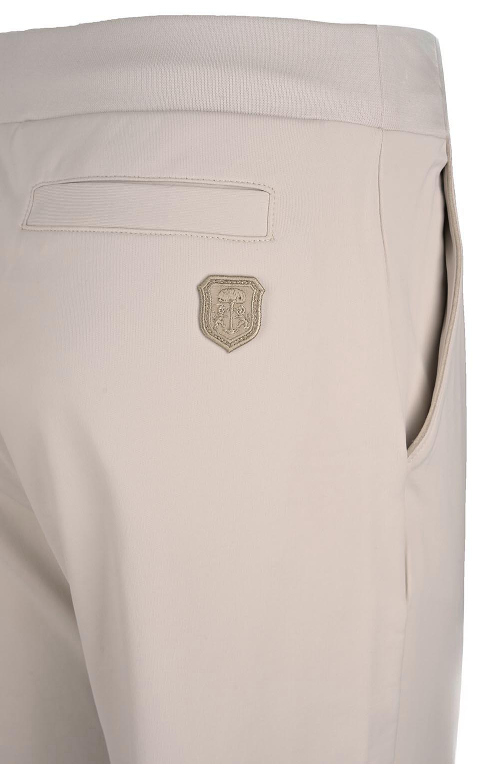 Спортивный костюм из эластичного хлопка и нейлона сливочного цвета